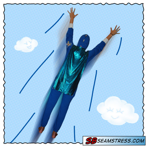 Elizabeth Davidson models a customized blue onesie with sparkle cape! It makes the clouds happy :)